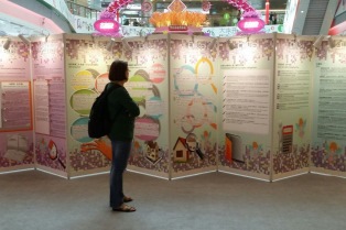 The photo shows visitors viewing exhibition panels at the roving exhibition to gain a better understanding of the Ordinance.