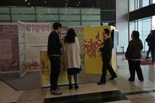 The photo shows visitors viewing exhibition panels at the roving exhibition to gain a better understanding of the Ordinance.